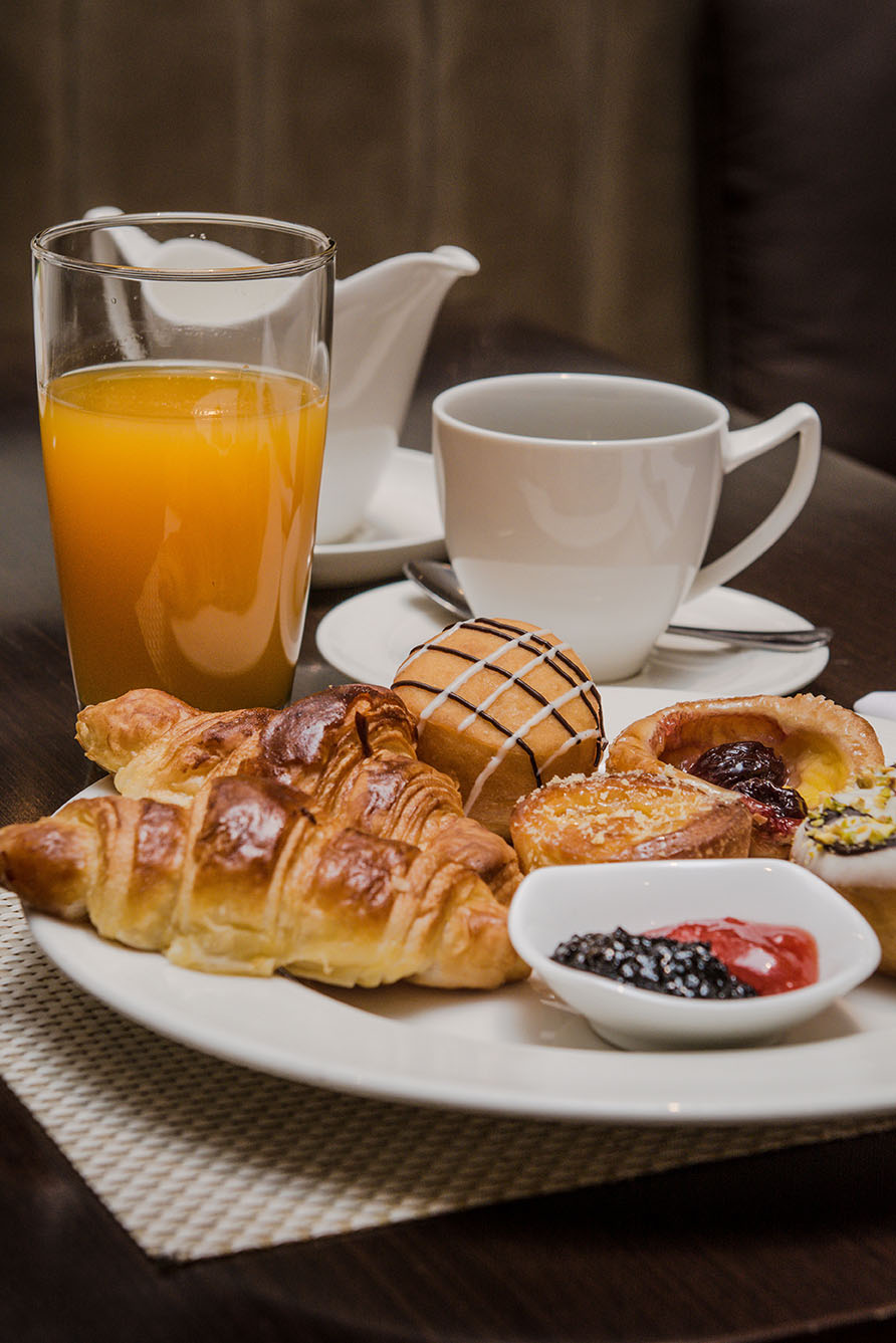 Breakfast pastries, coffee and orange juice